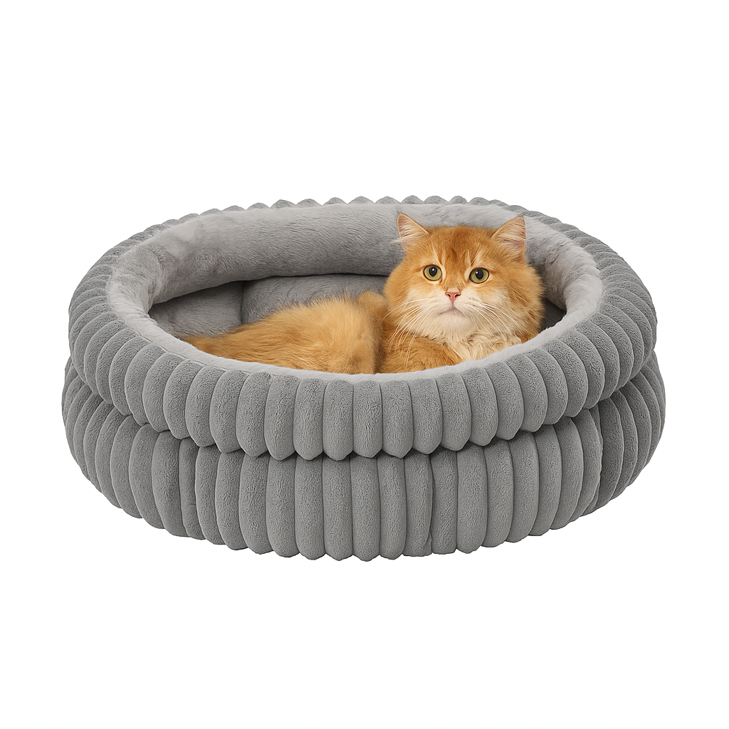 Cat lying in a gray ribbed pet bed on a white background